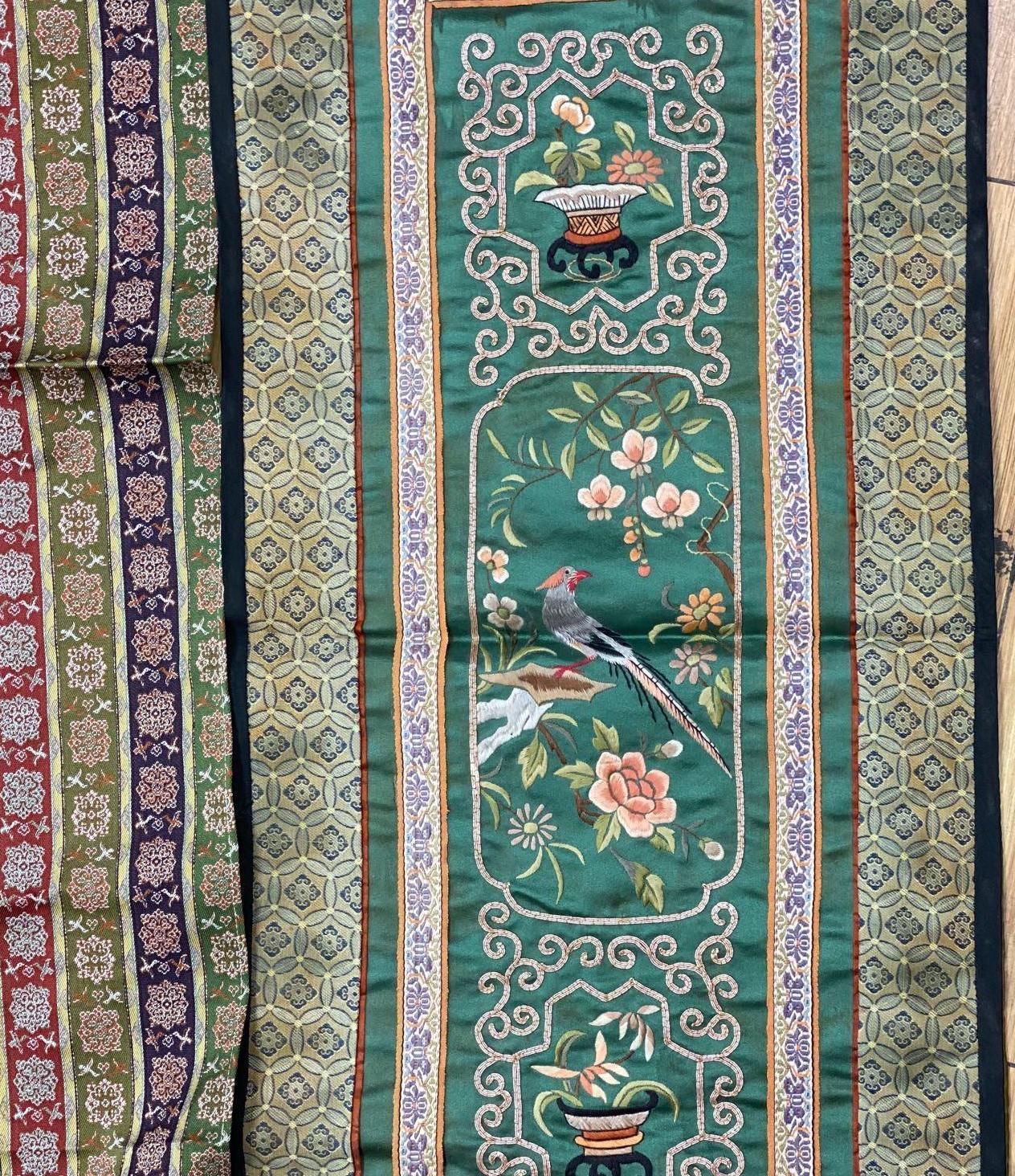 A collection of Chinese embroidered panels, a beaded Portuguese pocket, an Indian mirrored panel and a 19th century